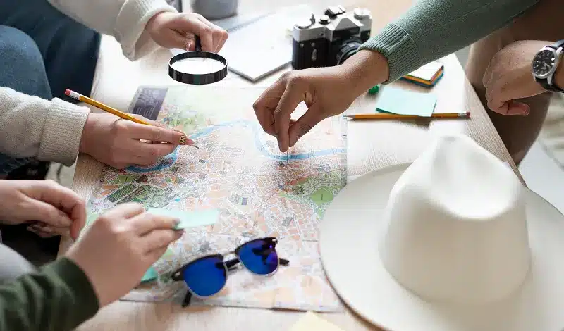 A travel agent is showing clients destinations in the maps