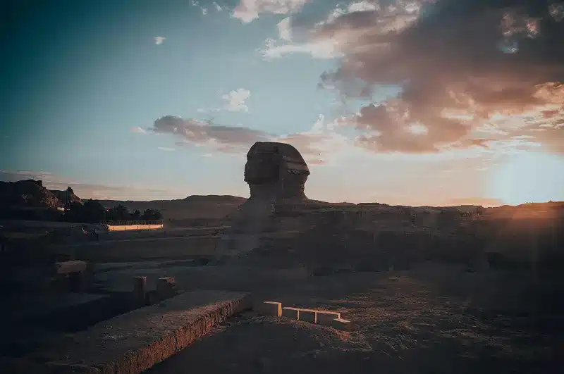 a large rock formation of the Sphinx in a desert