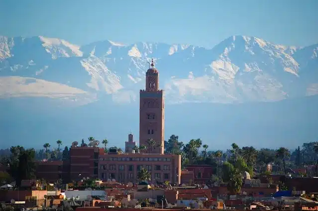 Al Koutoubia Mosque in Front of Atlas Mountains and Palm Tree as the Best Things to Do in Marrakech