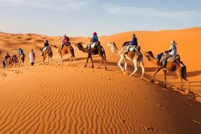 Sahara Desert Tourist hile enjoying a Morocco Itinerary Tours