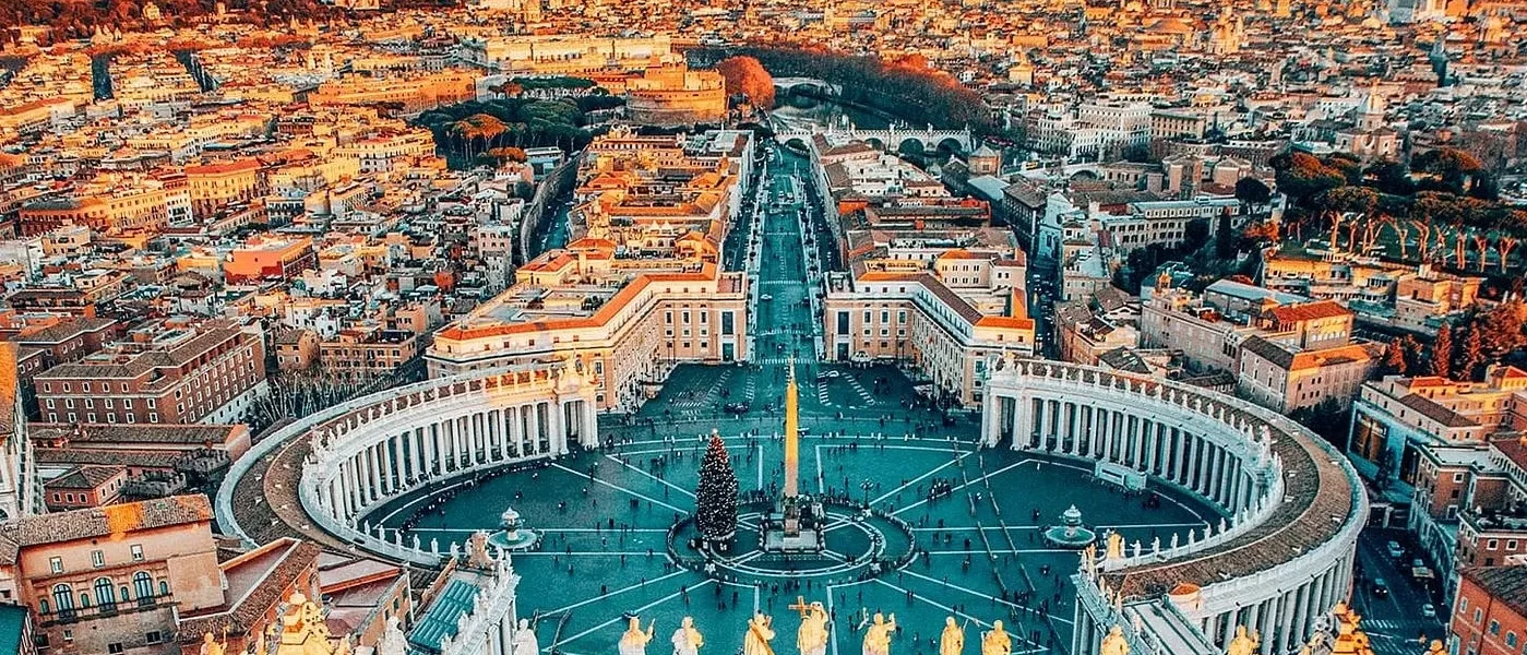 Aerial view of Rome showcasing its historic architecture and vibrant cityscape under a clear blue sky in our Italy itinerary Days