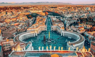 Aerial view of Rome showcasing its historic architecture and vibrant cityscape under a clear blue sky in our Italy itinerary Days