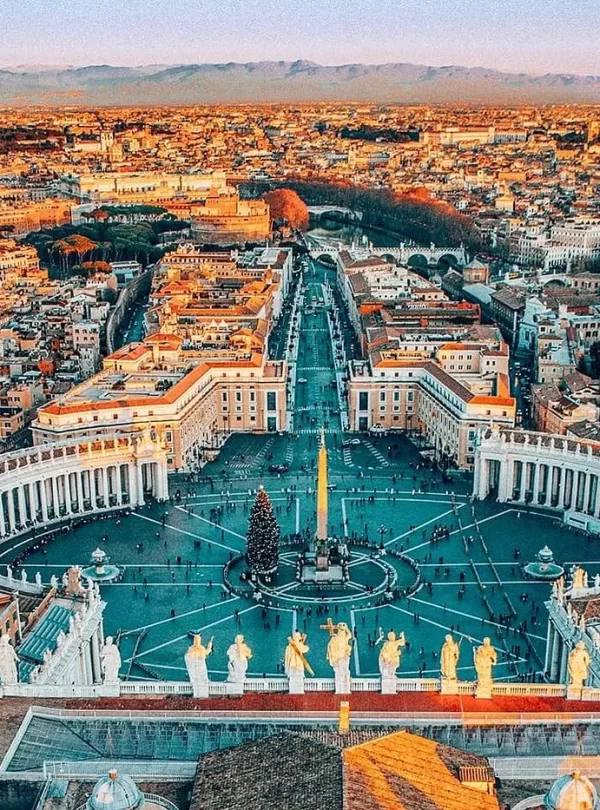 Aerial view of Rome showcasing its historic architecture and vibrant cityscape under a clear blue sky in our Italy itinerary Days