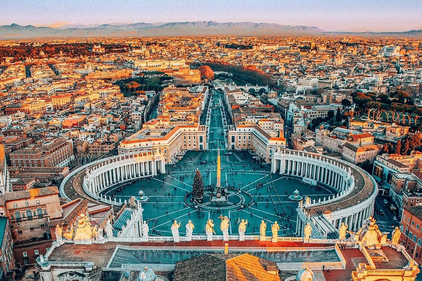 Aerial view of Rome showcasing its historic architecture and vibrant cityscape under a clear blue sky in our Italy itinerary Days