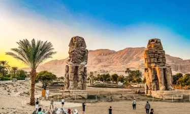 3. In the desert, ancient Egyptian statues endure, symbolizing the timeless artistry and history of ancient civilization while our Egypt itinerary 9 days
