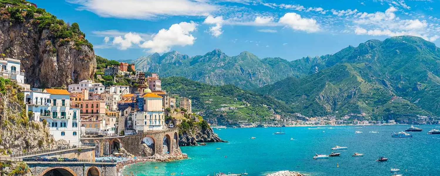 1. Scenic view of the Amalfi Coast in Italy, showcasing its stunning cliffs and vibrant coastal villages while our Italy itnerary 14 days