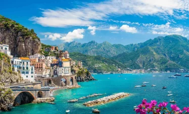 1. Scenic view of the Amalfi Coast in Italy, showcasing its stunning cliffs and vibrant coastal villages while our Italy itnerary 14 days
