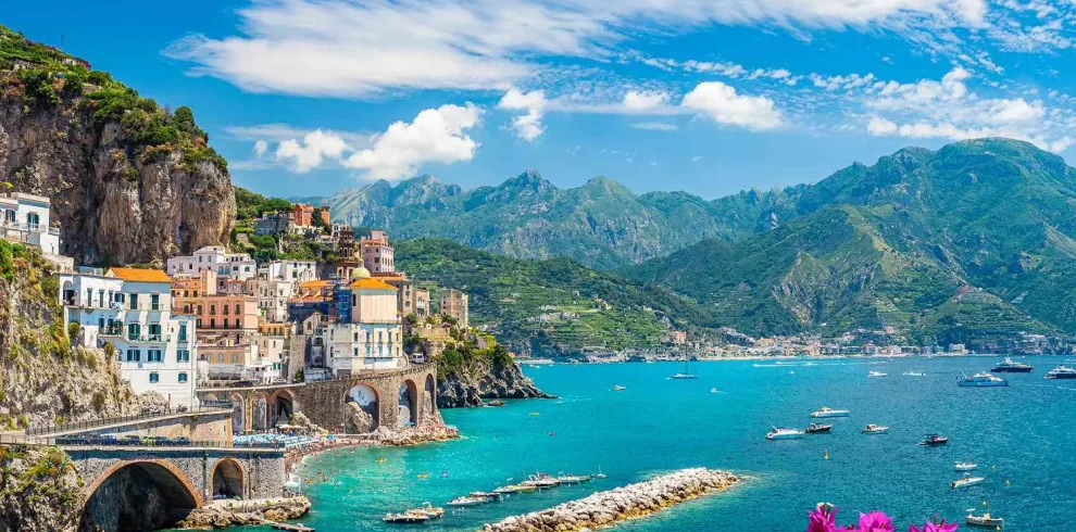 1. Scenic view of the Amalfi Coast in Italy, showcasing its stunning cliffs and vibrant coastal villages while our Italy itnerary 14 days