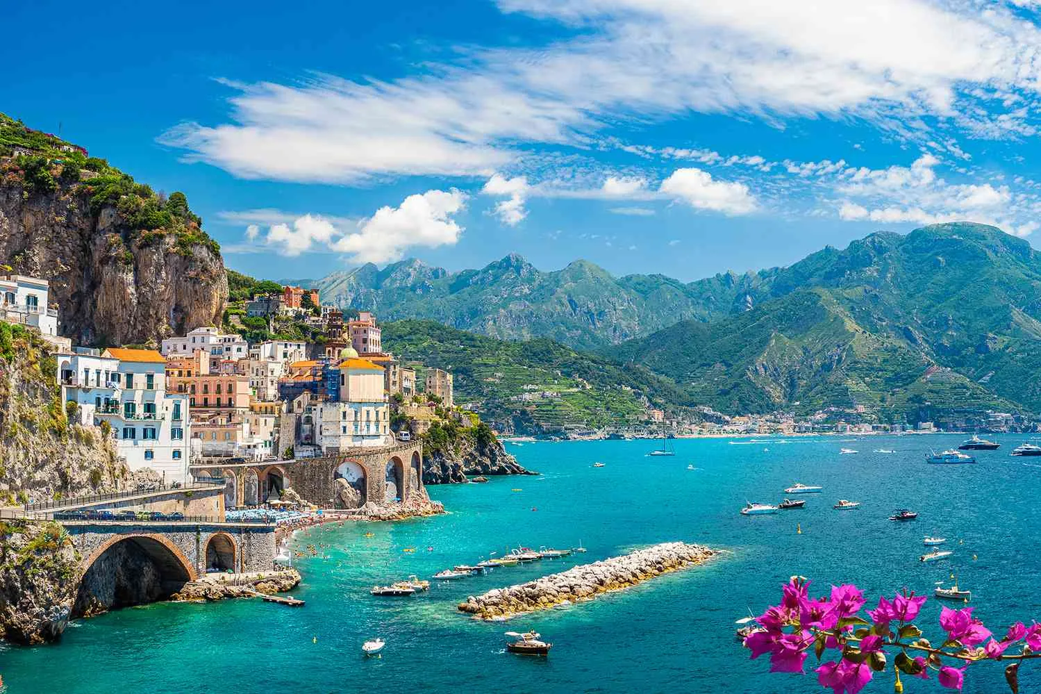 1. Scenic view of the Amalfi Coast in Italy, showcasing its stunning cliffs and vibrant coastal villages while our Italy itnerary 14 days