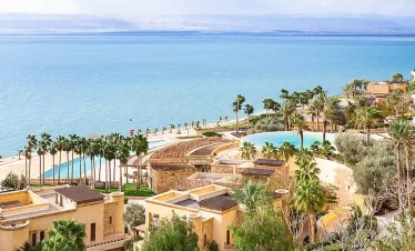 A serene view of the Dead Sea resort in Israel, showcasing its unique landscape and tranquil waters while our Jordan itineraryb 8 days