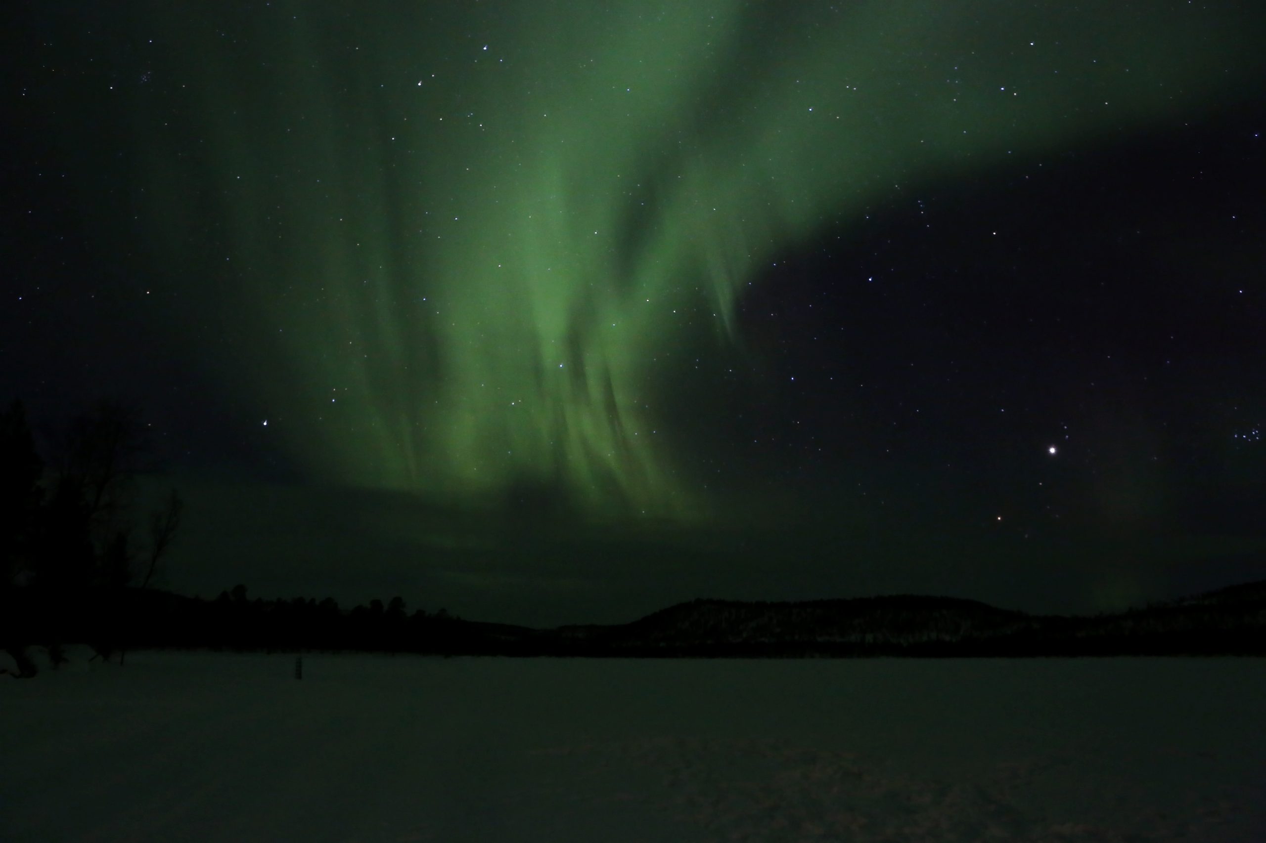 15-Day Luxury Iceland & Finland Tour – Northern Lights & Arctic Experiences 4 Aurora borealis over Lake Inari in Finland