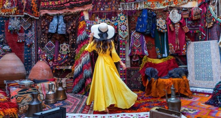 Beautiful girl at traditional carpet shop in Goreme city, Cappadocia in Turkey.
